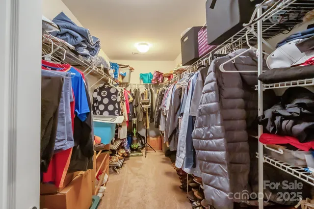 a bathroom with a double vanity sink toilet mirror and shower