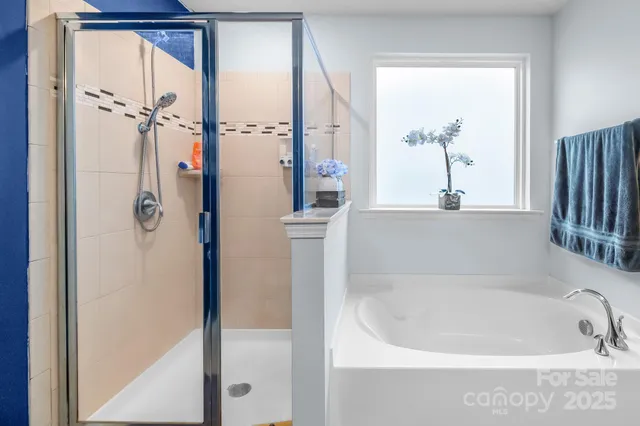 a bedroom with furniture and a flat screen tv