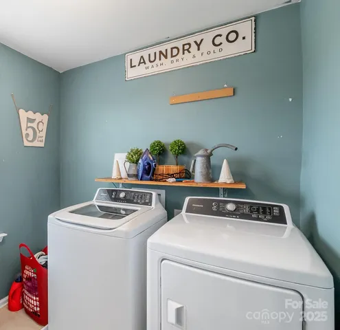 a living room with lots of furniture and white walls
