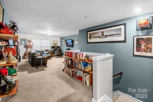 a bedroom with a bed and a book shelf
