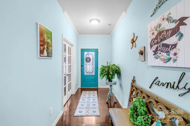 a view of an entryway with wooden floor