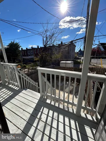 a view of balcony with wooden floor