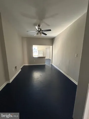 a view of wooden floor and windows in a room