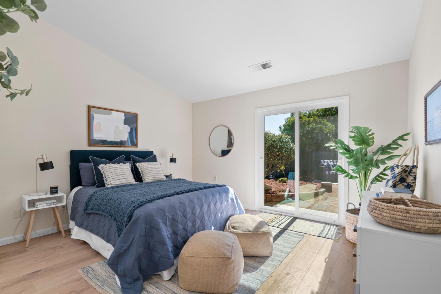 443 Sailfish Drive Aptos, CA 95003 - Photo 22 of 60 a bed room with a bed and a potted plant