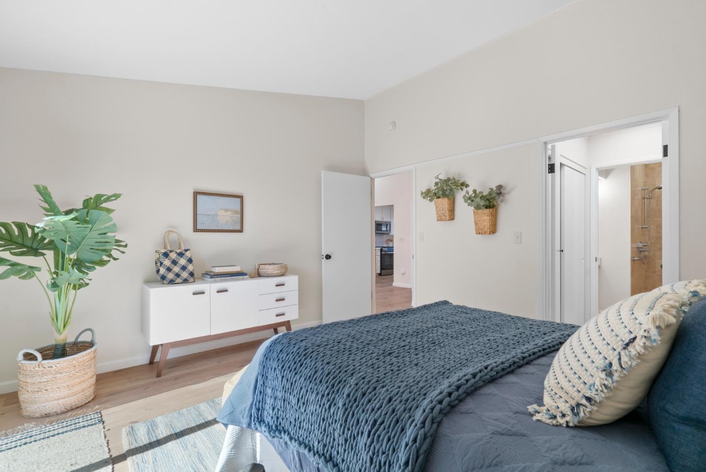 443 Sailfish Drive Aptos, CA 95003 - Photo 23 of 60 a bedroom with a bed and a potted plant