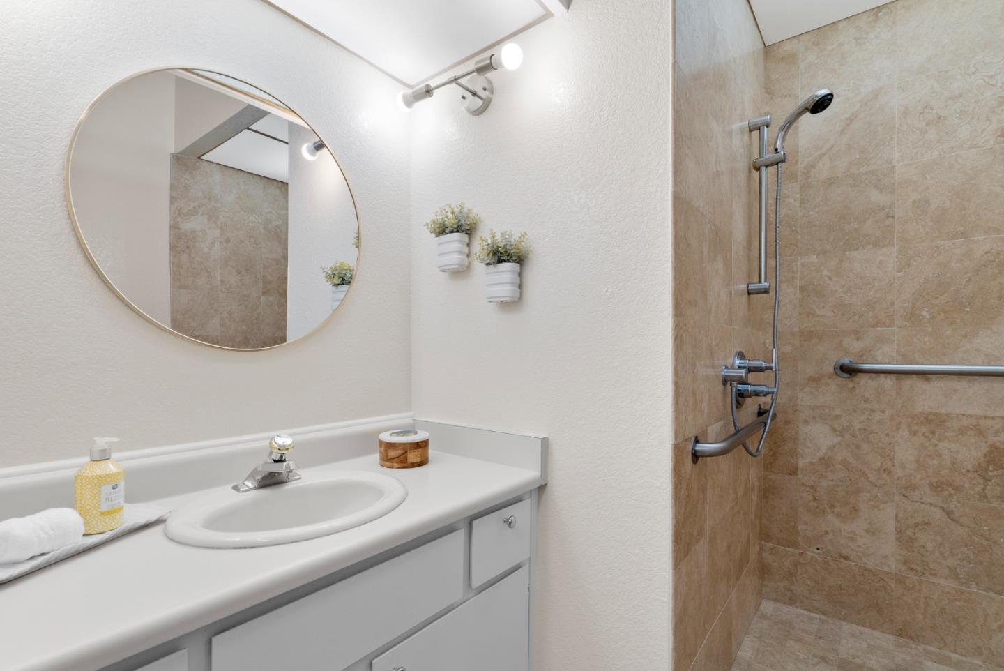 443 Sailfish Drive Aptos, CA 95003 - Photo 26 of 60 a bathroom with a sink and a mirror
