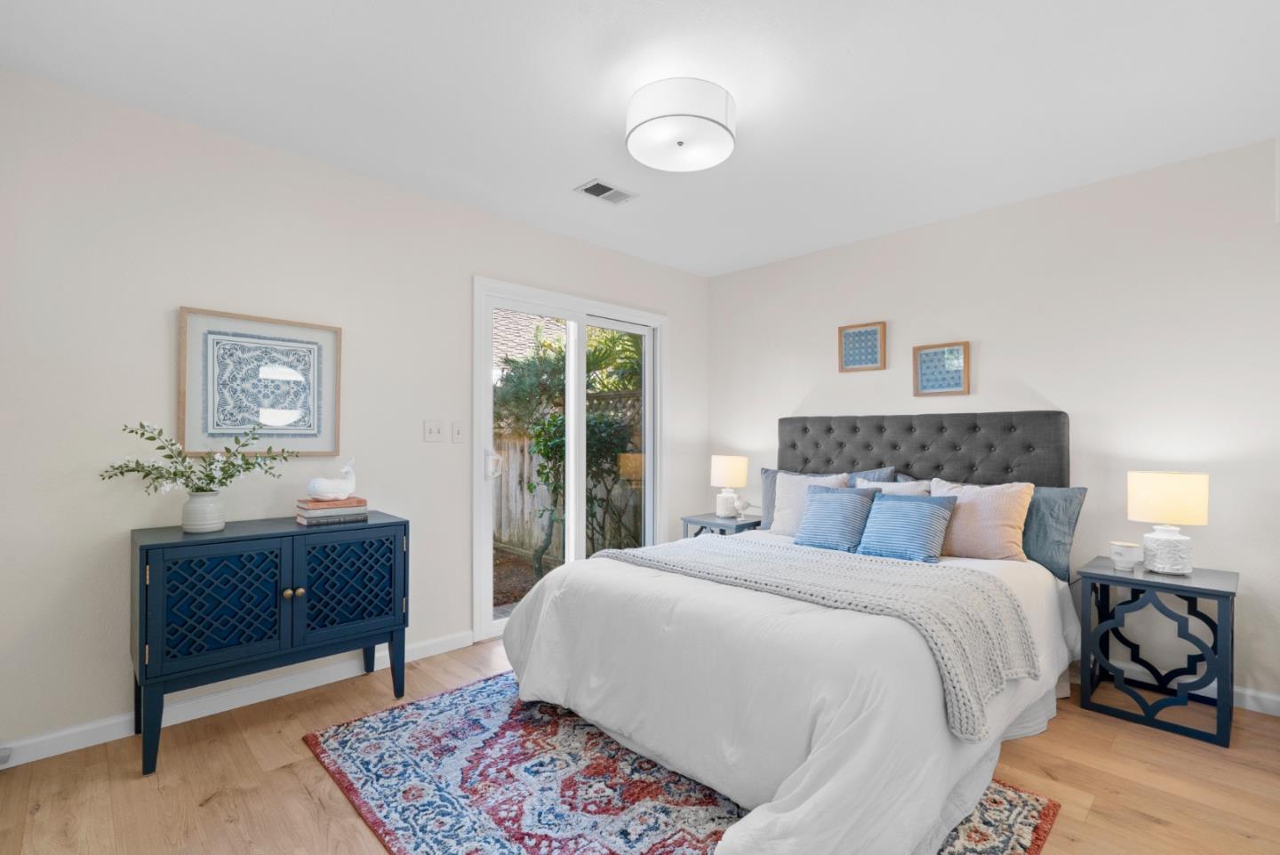 443 Sailfish Drive Aptos, CA 95003 - Photo 27 of 60 a bedroom with a large bed and a dresser