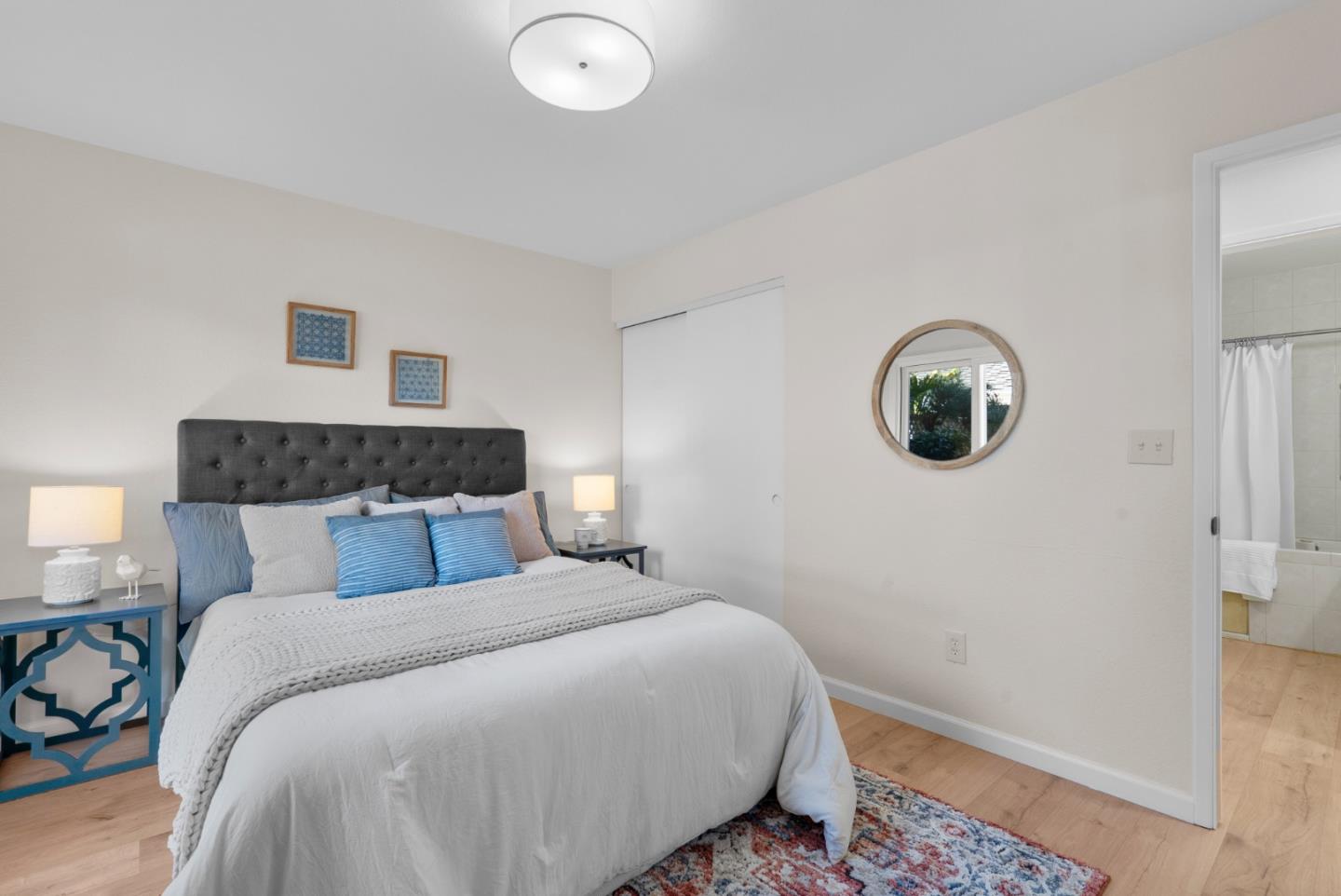 443 Sailfish Drive Aptos, CA 95003 - Photo 29 of 60 a bedroom with a bed and a chandelier