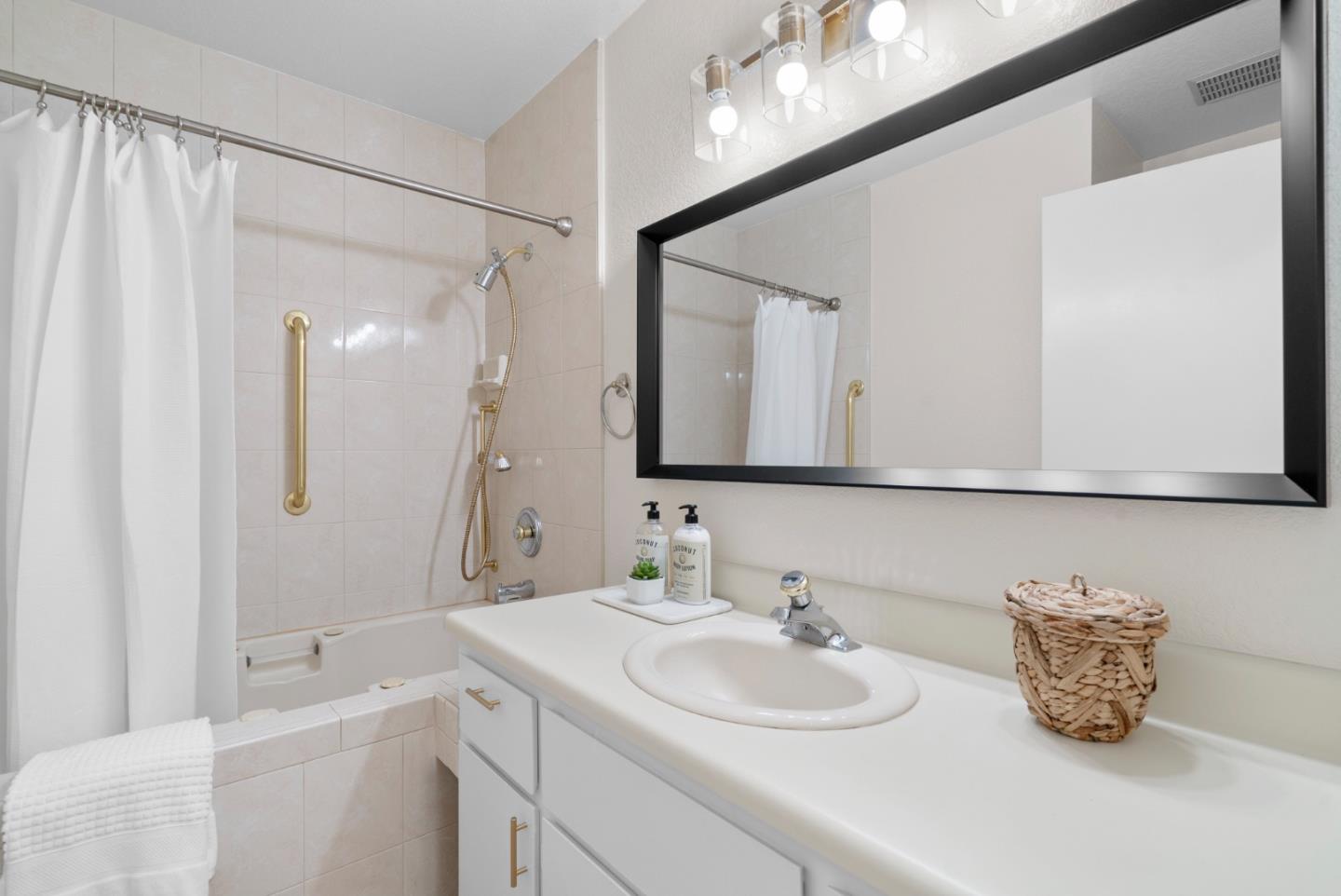 443 Sailfish Drive Aptos, CA 95003 - Photo 30 of 60 a bathroom with a sink and a mirror