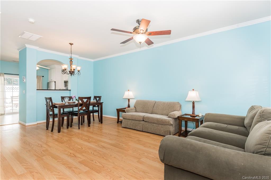752 Shellstone Place Fort Mill, SC 29708 - Photo 3 of 23 a living room with furniture dining table and a chandelier