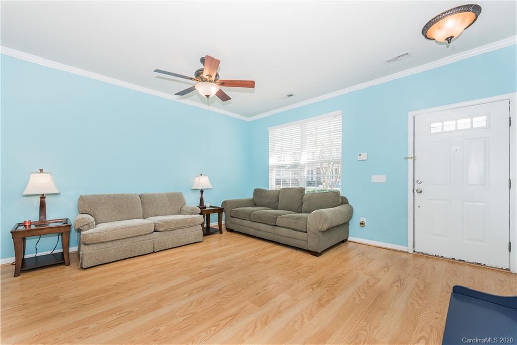 752 Shellstone Place Fort Mill, SC 29708 - Photo 4 of 23 a living room with furniture and a wooden floor