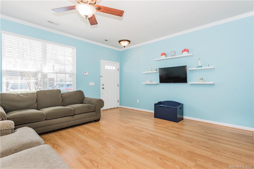 752 Shellstone Place Fort Mill, SC 29708 - Photo 5 of 23 a living room with furniture and a flat screen tv