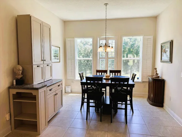 a view of a dining room with furniture window and outside view