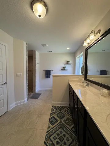 a kitchen with a sink and a refrigerator