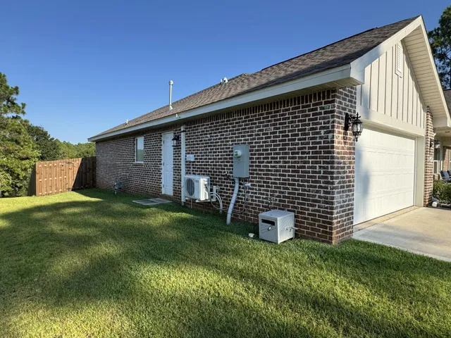 a backyard of a house with lots of green space