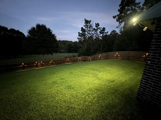 a view of a swimming pool with a yard