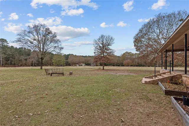 a backyard of a house with a yard and garage