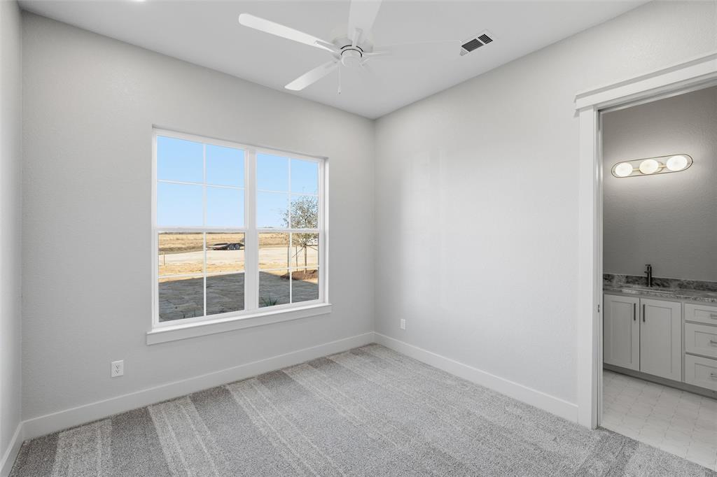 348 Lacek Mill Road China Spring, TX 76633 - Photo 14 of 40 an empty room with a empty space and windows