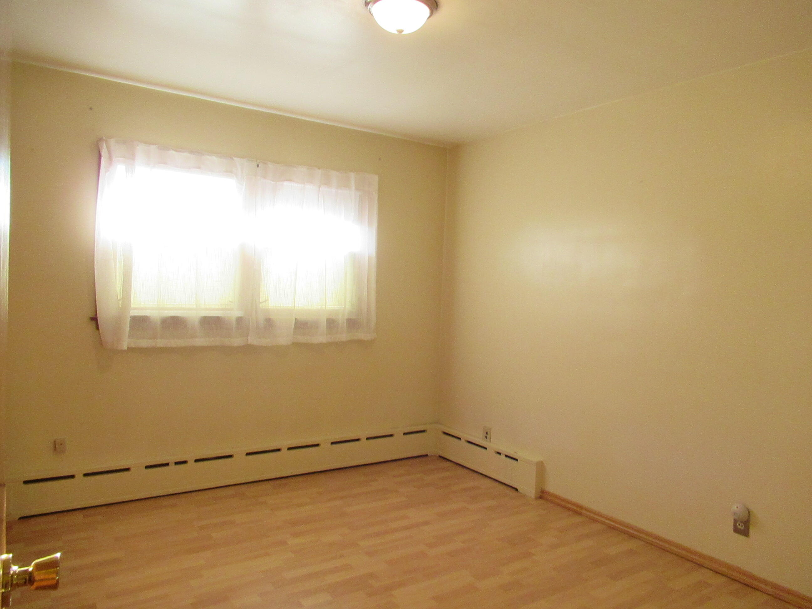 7230 Beech Avenue Hammond, IN 46324 - Photo 7 of 13 a view of an empty room with a window