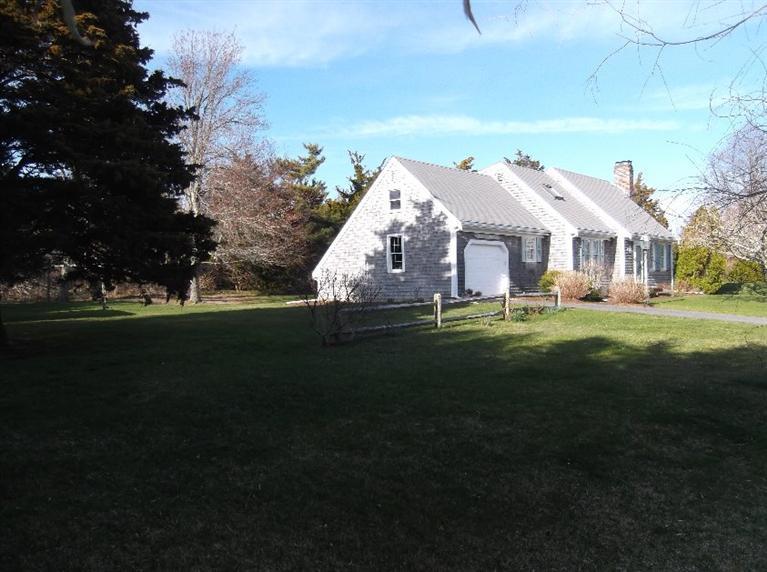 30 Twiss Road Orleans, MA 02653 - Photo 4 of 29 a front view of a house with a garden