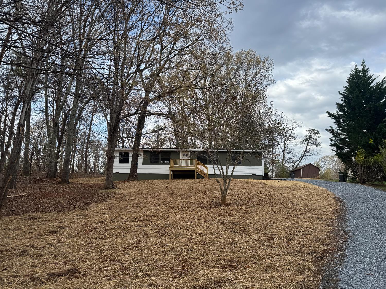 137 Ridgeview Lane Madison Heights, VA 24572 - Photo 1 of 22 a wooden bench sitting in middle of a yard