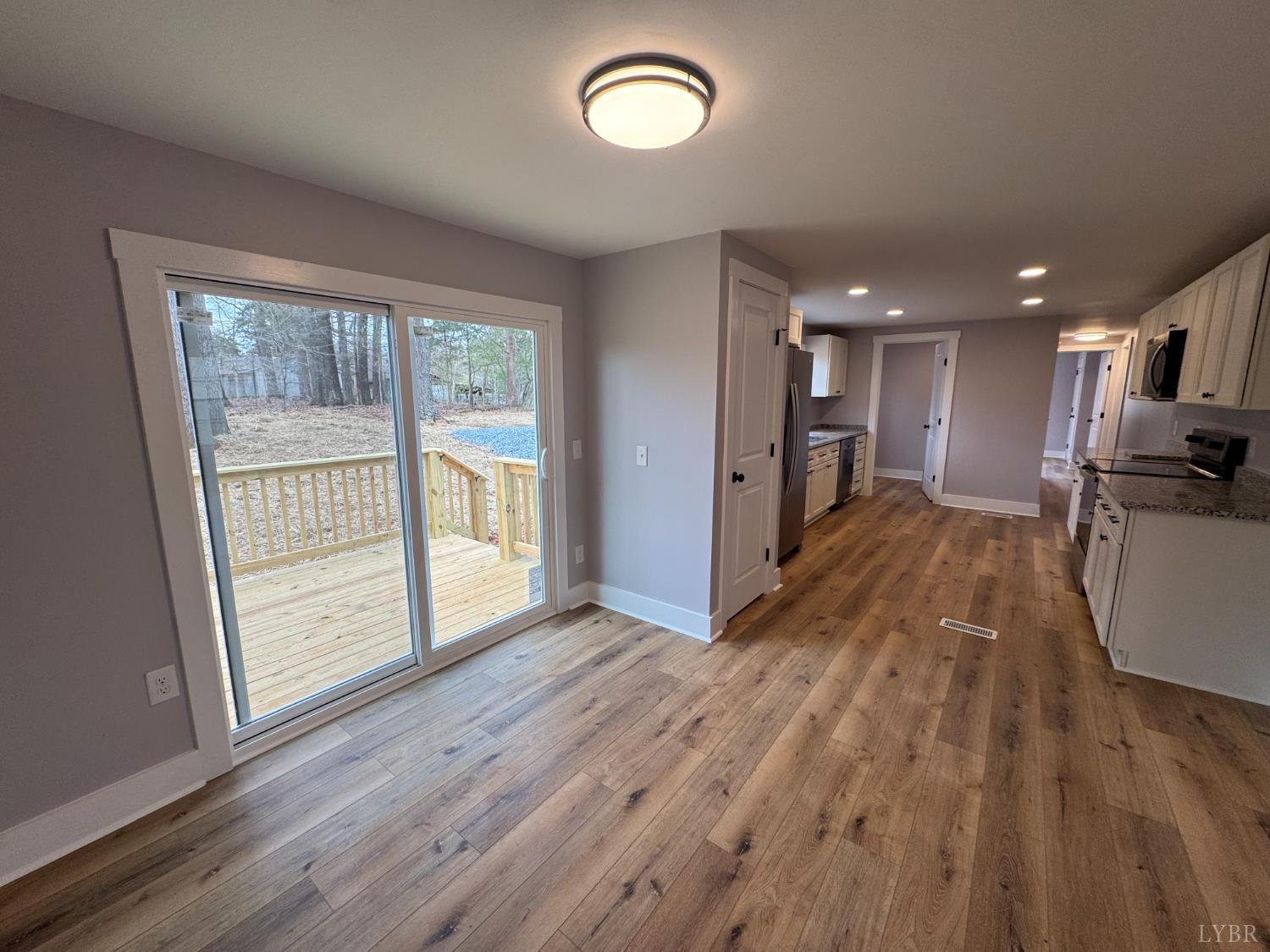 137 Ridgeview Lane Madison Heights, VA 24572 - Photo 16 of 22 an empty room with wooden floor and windows