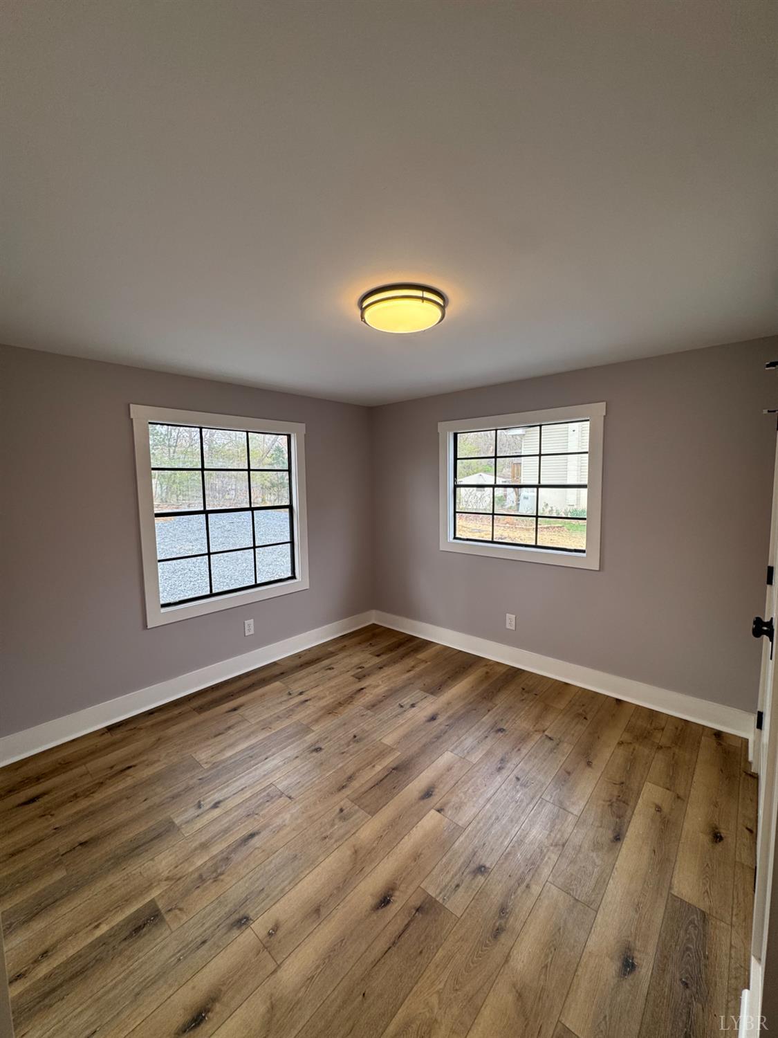 137 Ridgeview Lane Madison Heights, VA 24572 - Photo 19 of 22 a view of an empty room with wooden floor and a window