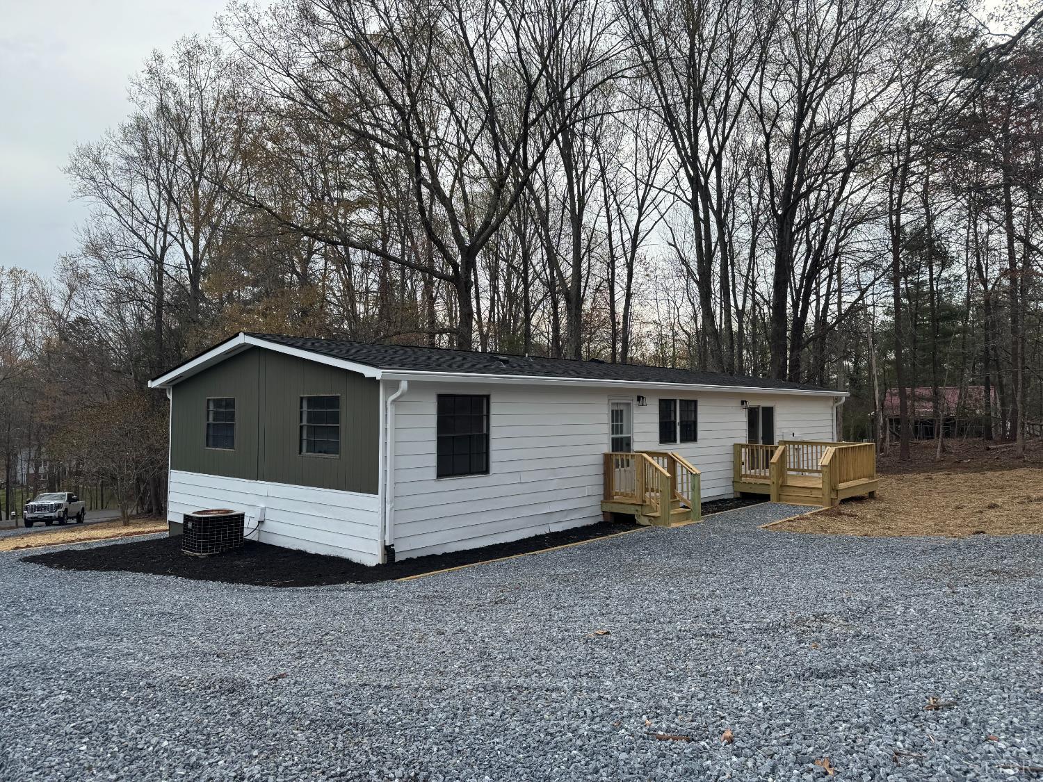 137 Ridgeview Lane Madison Heights, VA 24572 - Photo 3 of 22 a white house that has a tree in front of it