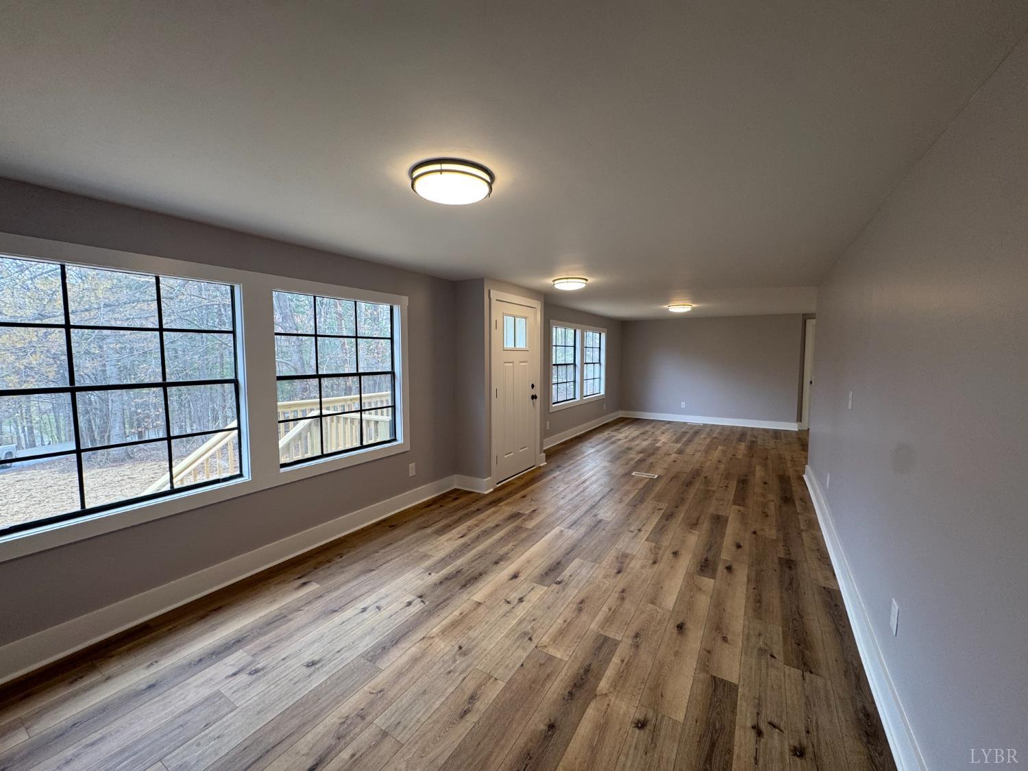 137 Ridgeview Lane Madison Heights, VA 24572 - Photo 10 of 22 wooden floor in an empty room with a window