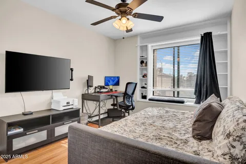 a bathroom with a tub a sink and mirror