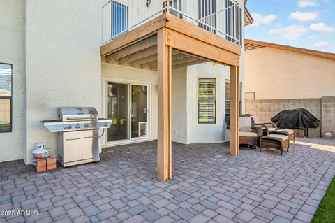 a bathroom with a granite countertop toilet sink and mirror