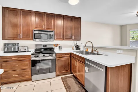 a living room with furniture fireplace and flat screen tv