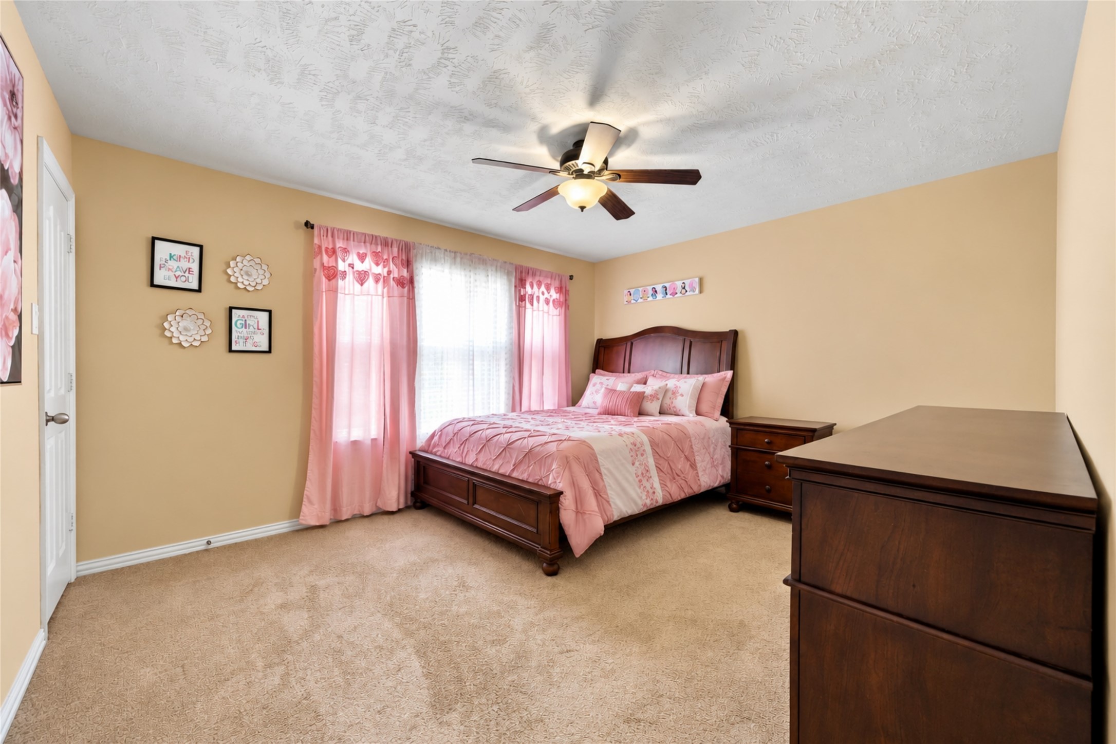 8338 Rudy Brook Way Spring, TX 77379 - Photo 28 of 33 A spacious secondary bedroom provides flexibility for family, guests, hobbies, or a home workspace.