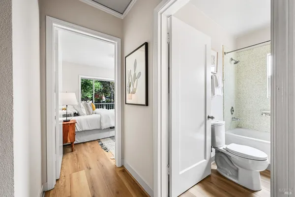 a bedroom with a bed and a lamp