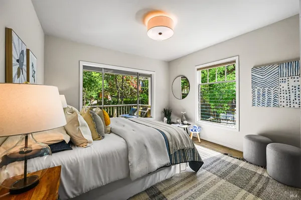 a en suite bathroom with a granite countertop sink and a mirror