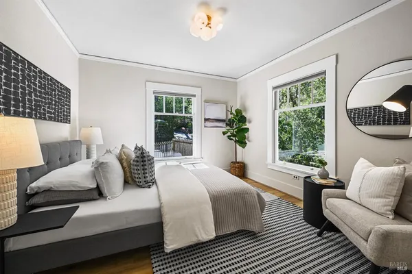 a bathroom with a granite countertop sink toilet a mirror and bathtub
