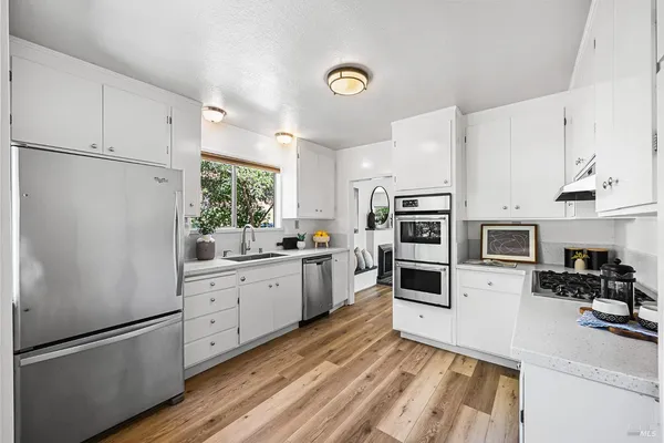 a dining room with furniture a window and a rug