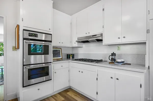 a dining room with furniture and a window