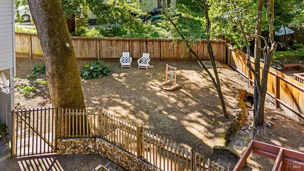a balcony with chairs and a table