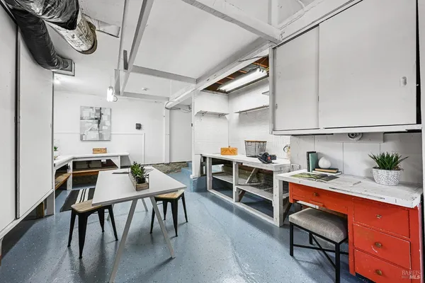 a view of a patio with couches table and chairs potted plants
