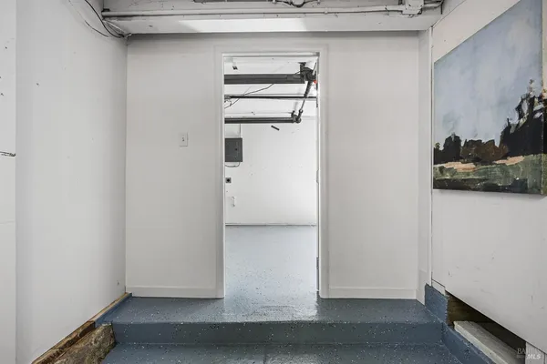 a view of a patio with couches table and chairs and potted plants