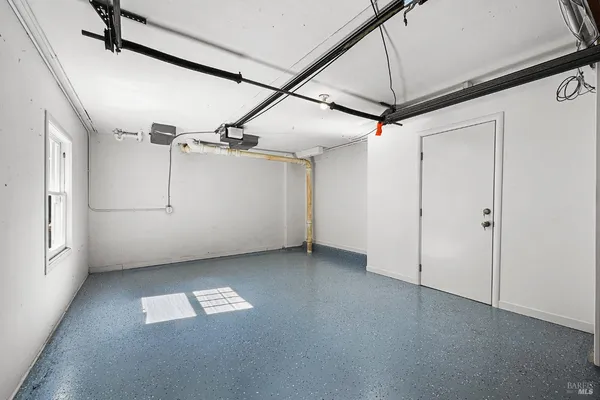 a view of a chairs and table in the patio