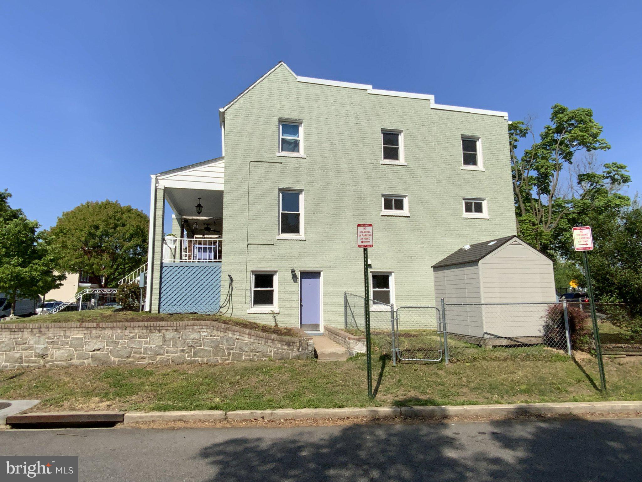 1772 E Street Northeast Washington, DC 20002 - Photo 3 of 23 a front view of a house with a yard and garage