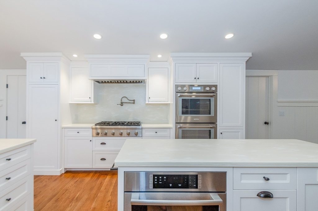 345 Point Road Marion, MA 02738 - Photo 12 of 41 a kitchen with stainless steel appliances granite countertop a stove and a refrigerator