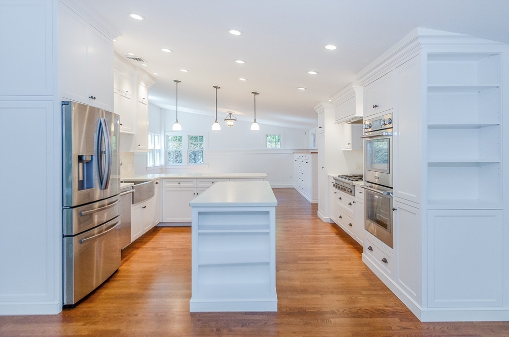 345 Point Road Marion, MA 02738 - Photo 13 of 41 a large kitchen with stainless steel appliances a large counter top oven and a refrigerator