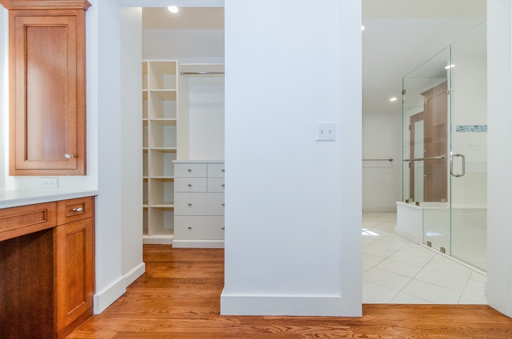 345 Point Road Marion, MA 02738 - Photo 24 of 41 an empty room with wooden floor and cabinet