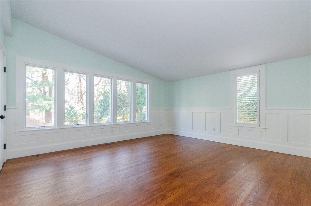 345 Point Road Marion, MA 02738 - Photo 25 of 41 an empty room with wooden floor and windows