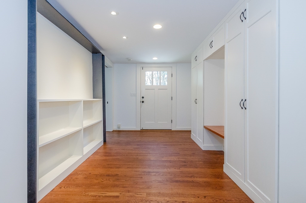 345 Point Road Marion, MA 02738 - Photo 27 of 41 a view of a big room with wooden floor and windows