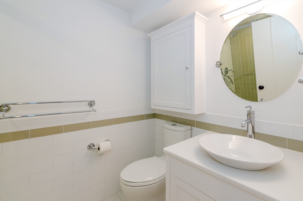 345 Point Road Marion, MA 02738 - Photo 28 of 41 a bathroom with a sink and a mirror