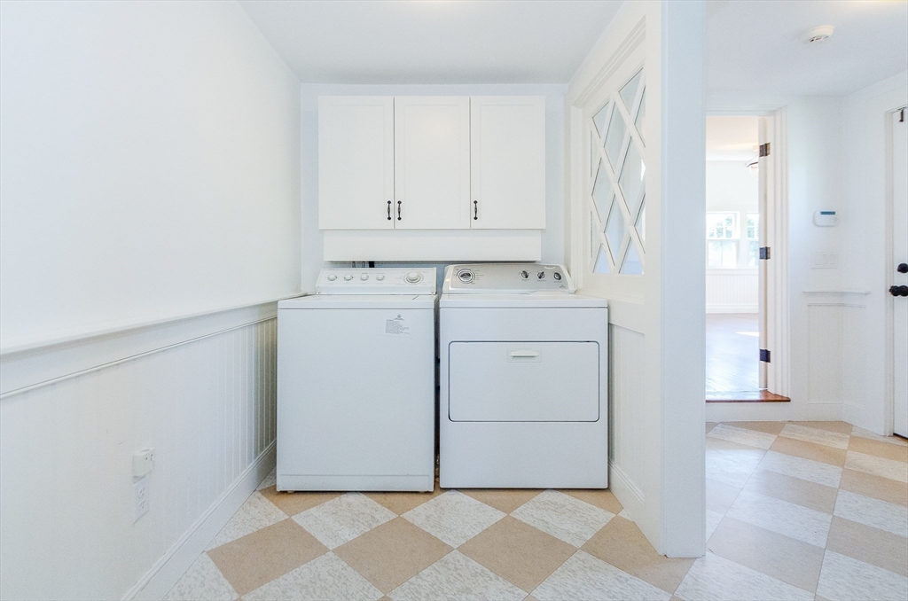 345 Point Road Marion, MA 02738 - Photo 35 of 41 a utility room with cabinets washer and dryer